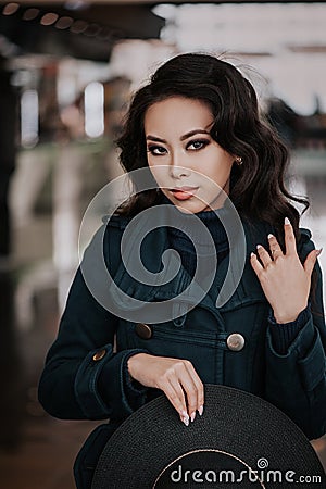 Fashionable girl in coat Stock Photo