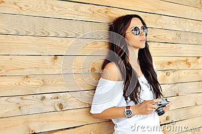 Fashionable girl with old camera Stock Photo