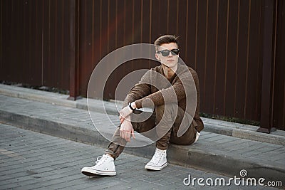 Fashionable hipster man with sunglasses and fashionable clothes Stock Photo