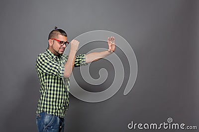 Fashionable hipster man using imaginative tube in studio Stock Photo