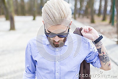 Fashionable hipster in park Stock Photo