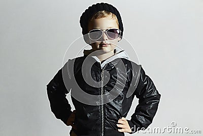 Fashionable little boy in sunglasses. Child in Black cap. Winter style.Kids fashion Stock Photo