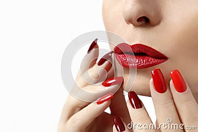Fashionable makeup and manicure in dark red and light shades of nail Polish. Stock Photo