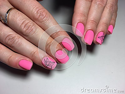 fashionable matte pink manicure with abstraction Stock Photo
