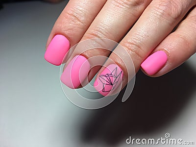 fashionable matte pink manicure with abstraction Stock Photo