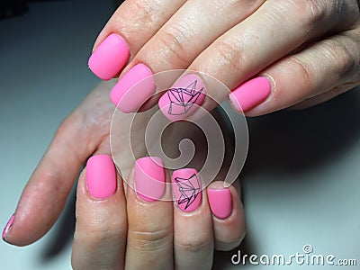 fashionable matte pink manicure with abstraction Stock Photo