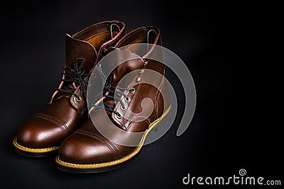 Fashionable mens leather brown shoes on black background Stock Photo