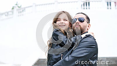 Dad and daughter walk around the city Stock Photo