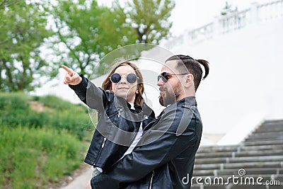 Dad and daughter walk around the city Stock Photo