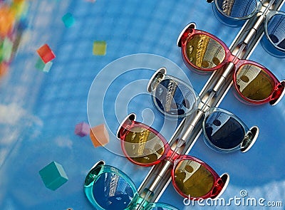 Fashionable sunglasses of different models on blue background Stock Photo