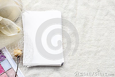 fashionable white stock background is a blank for a postcard. An empty letterhead for the inscription, dry roses and a white hat Stock Photo