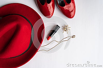 Fashionable women`s cosmetics and accessories flat lay in red color. Stock Photo