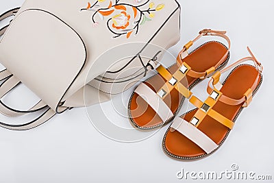 Fashionable women`s sandals and backpack on white background Stock Photo