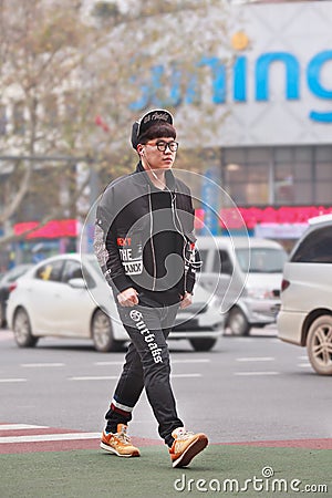 Fashionable young man in city center, Yiwu, China Editorial Stock Photo