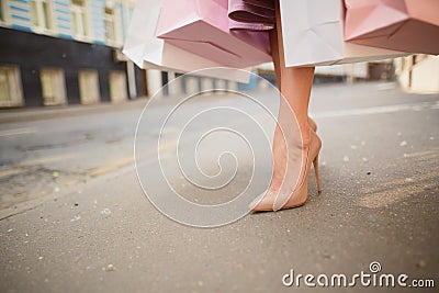 Fashionably dressed woman on the streets of a small town, shopping concept Stock Photo