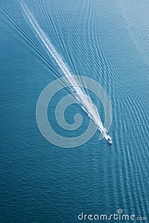 Fast boat moving in ocean Stock Photo