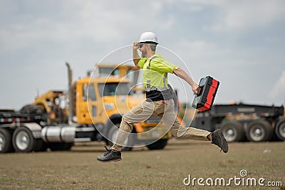 Fast building. Funny construction worker jumping. Excited jump of builders in helmet. Worker in hardhat. Construction Stock Photo