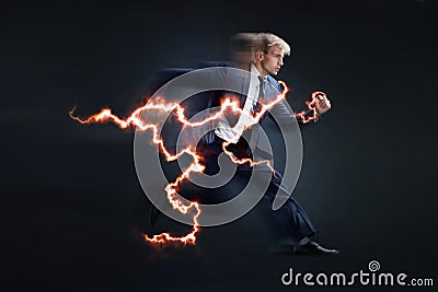 Fast business. Running businessman charged with lightning, concept Stock Photo