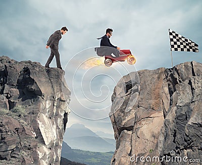 Fast businessman with a car wins against the competitors. Concept of success and competition Stock Photo
