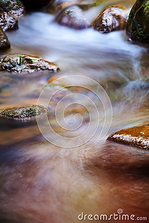 Fast flowing water in the mountain Stock Photo
