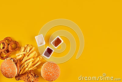 Fast food dish top view. Meat burger, potato chips and wedges. Take away composition. French fries, hamburger Stock Photo