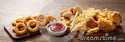 Fast food meals : onion rings, french fries, chicken nuggets and fried chicken Stock Photo