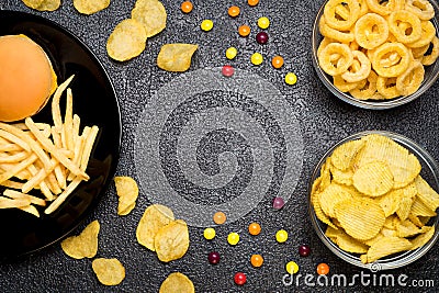 Fast food: top view of burger, french fries, chips, rings and ca Stock Photo