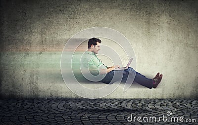 Fast internet. Autonomous self driving car technology. Levitating business man on road using laptop Stock Photo