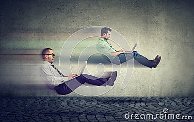 Fast internet concept. Two levitating business men on road using Stock Photo