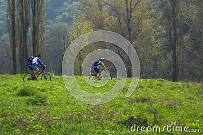 Fast motion bikers Stock Photo