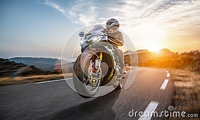 Fast motorbike on the coastal road riding. having fun driving the empty highway on a motorcycle tour journey Stock Photo