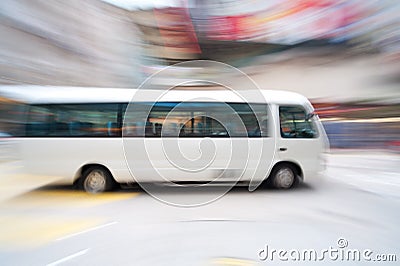 Fast moving bus Stock Photo