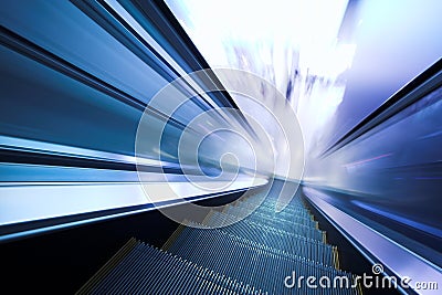 Fast moving escalator Stock Photo