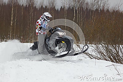 Fast moving snowmobile rider Editorial Stock Photo