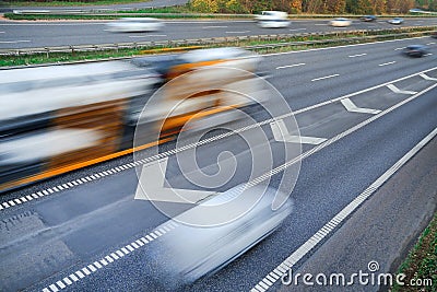 Fast moving vehicles at motion blur Stock Photo