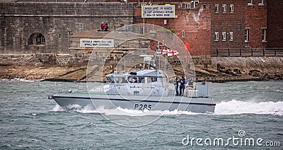 Fast Patrol Ship HMS Sabre heading out to sea in Portsmouth Harbour, Hampshire, UK Editorial Stock Photo