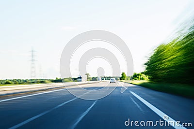 Fast speeding car on highway POV Stock Photo