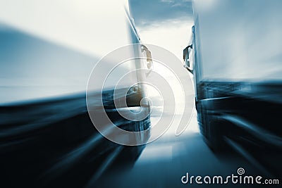 Fast Speeding Motion of Semi Trailer Trucks Driving on the Road. Diesel Truck. Freight Truck Logistics Shipping Cargo Transport Stock Photo