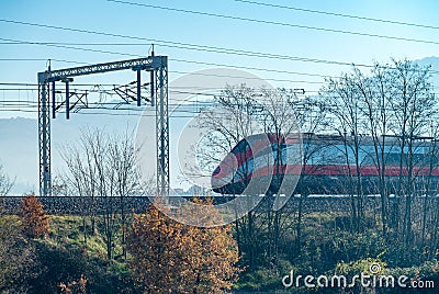 Fast speeding up train in countryside railway Stock Photo