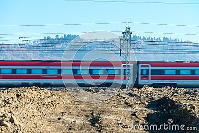 Fast speeding up train in countryside railway Stock Photo