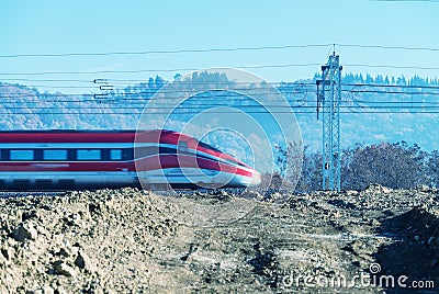 Fast speeding up train in countryside railway Stock Photo