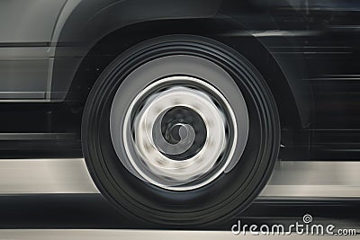 Fast Spinning Truck Wheels. Truck Speed Driving on the Road. Freight Truck Transportation Stock Photo