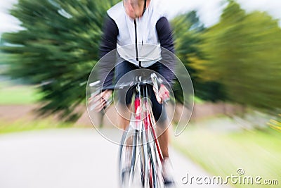Fast Sport Bicyclist on bike with motion blur Stock Photo