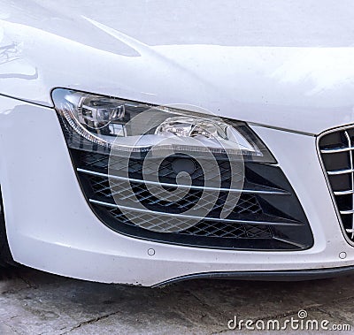 Fast white car and headlight close Stock Photo