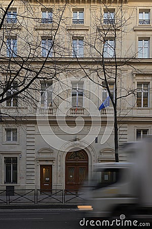 Fast white truck running fast in front the turgot college in Paris Editorial Stock Photo