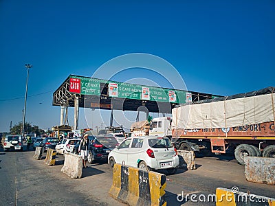 Fastag enabled toll booth plaza and toll gates with traffic lined up in each gate Editorial Stock Photo