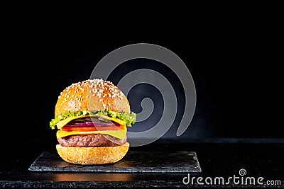 Fastfood burger cheeseburger with cutlet, cheese and vegetables Stock Photo