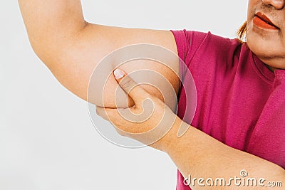 Fat Asian women have too much fat on their arms. Stock Photo
