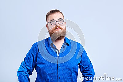 A fat, bearded man clever with glasses with a clever stupid expr Stock Photo