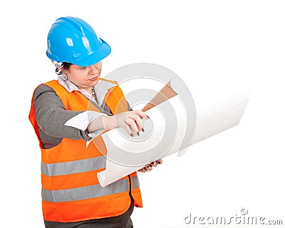 Fat female architect or engineer reading blueprint Stock Photo